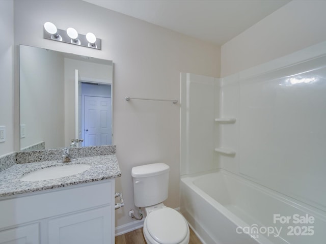 full bathroom featuring vanity, bathtub / shower combination, and toilet