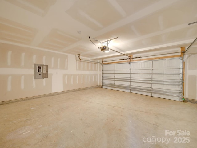 garage featuring a garage door opener and electric panel