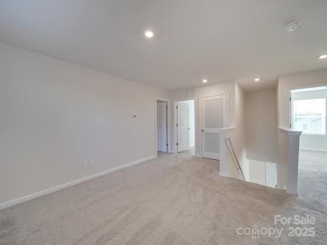 empty room with light colored carpet