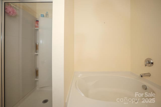 bathroom with separate shower and tub