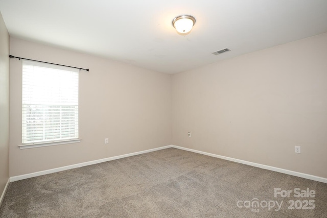 empty room with carpet flooring