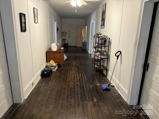 hallway featuring dark hardwood / wood-style flooring