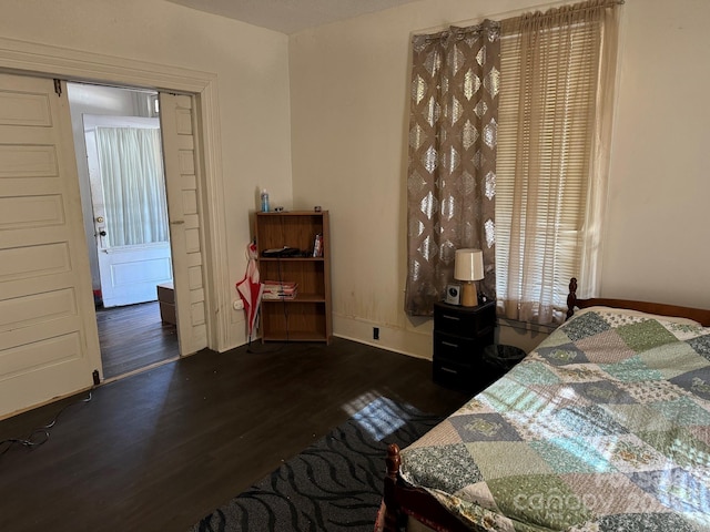 bedroom featuring dark wood-type flooring