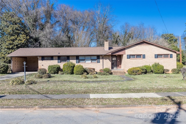 single story home featuring brick siding, a chimney, and a front lawn