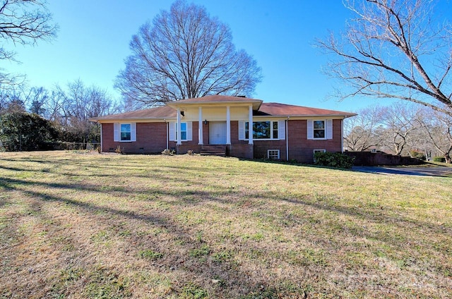 single story home featuring a front lawn