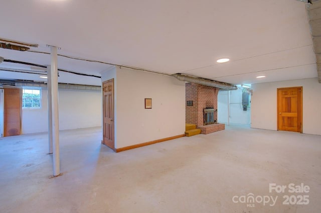 basement featuring a brick fireplace