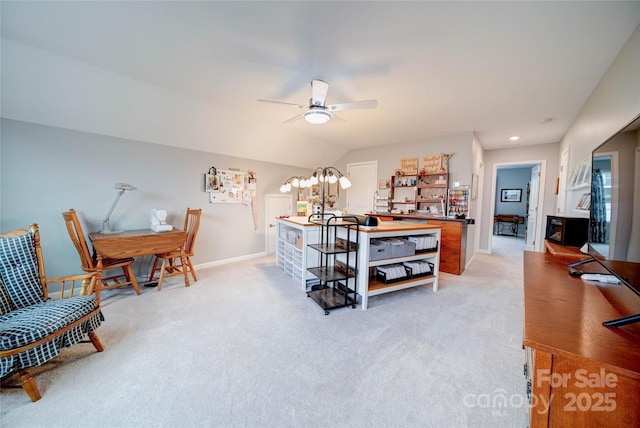 interior space with ceiling fan and lofted ceiling