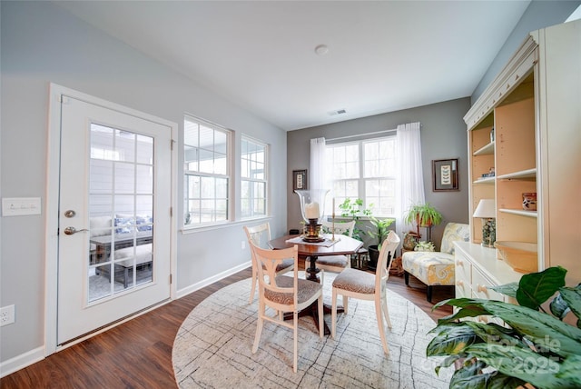 dining area with hardwood / wood-style floors