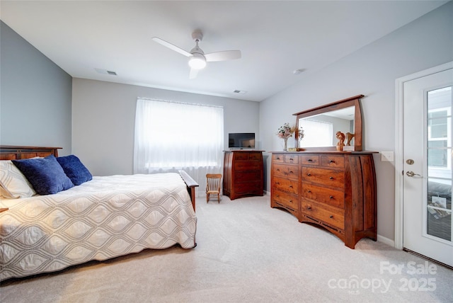 bedroom with light carpet, access to exterior, and ceiling fan