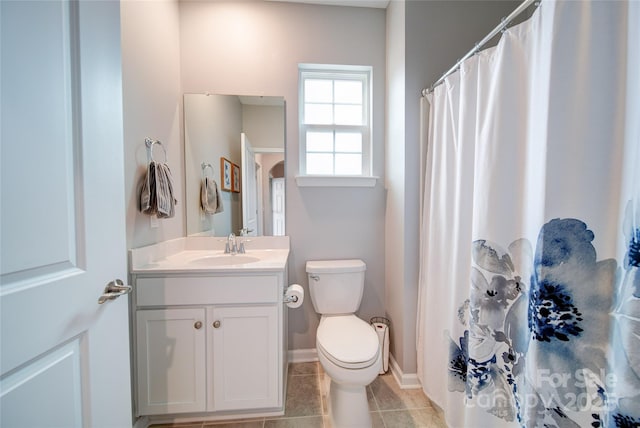 bathroom featuring tile patterned floors, vanity, toilet, and curtained shower