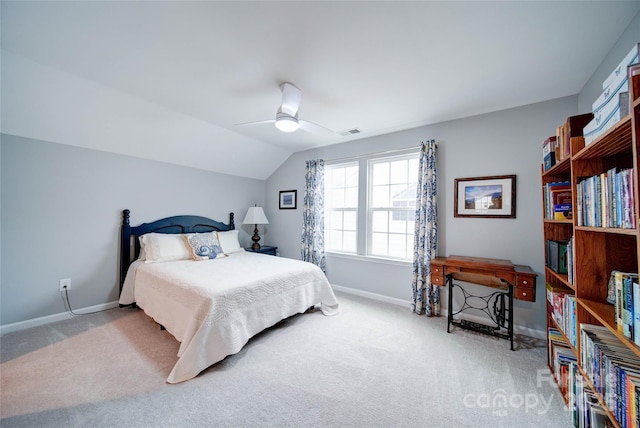 carpeted bedroom with ceiling fan and lofted ceiling