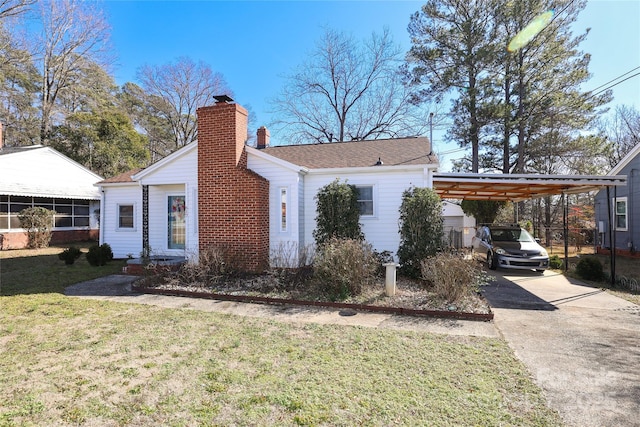 exterior space with a front yard and a carport