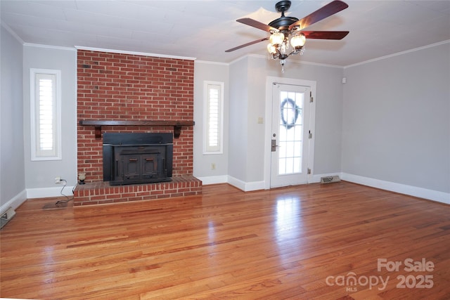 unfurnished living room featuring crown molding, light hardwood / wood-style flooring, and ceiling fan