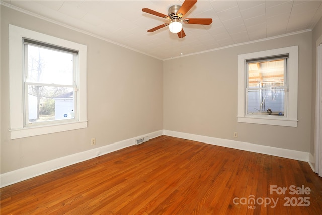 spare room featuring crown molding, ceiling fan, and wood-type flooring