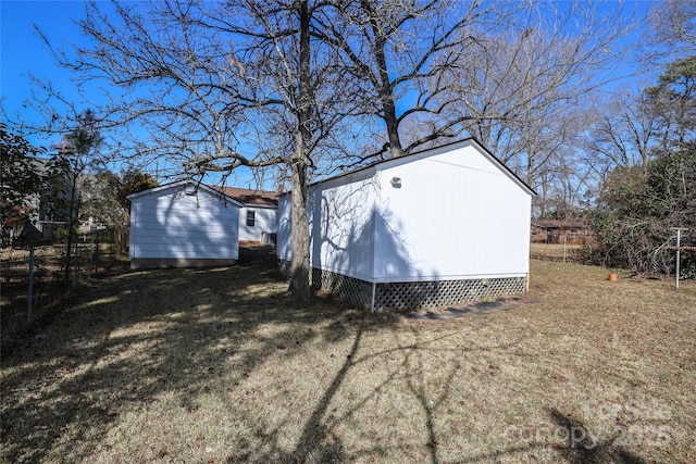 view of outdoor structure with a lawn