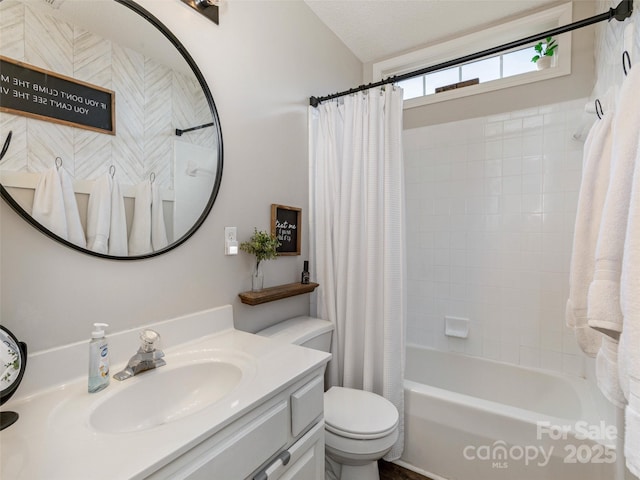 full bathroom with toilet, vanity, and shower / bathtub combination with curtain