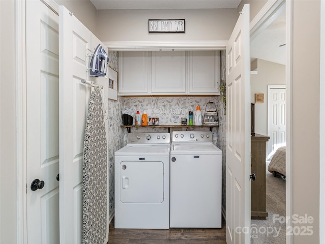 laundry room featuring cabinets, washer and dryer, and dark carpet