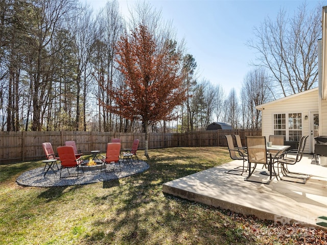 view of yard with a fire pit and a patio area