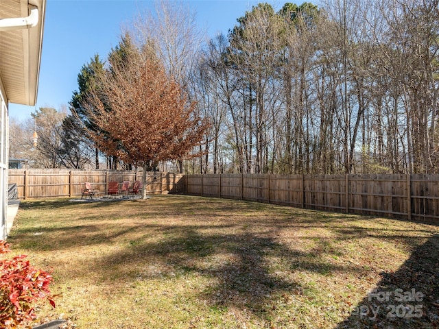 view of yard with a fenced backyard