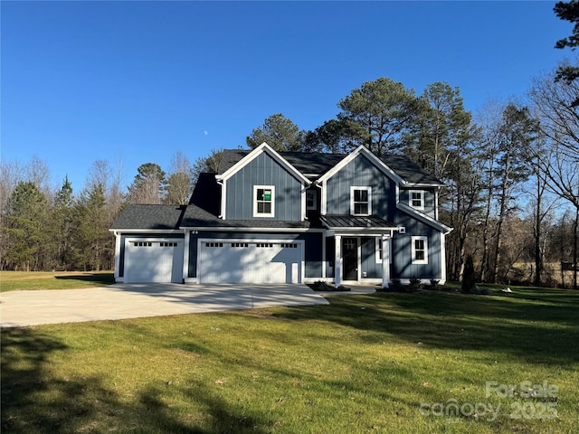 view of front of home featuring concrete driveway, board and batten siding, a standing seam roof, metal roof, and a front lawn