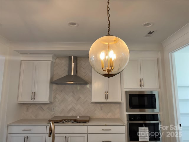 kitchen with tasteful backsplash, light countertops, stainless steel oven, wall chimney range hood, and built in microwave