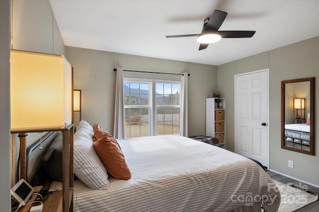 bedroom featuring hardwood / wood-style flooring and ceiling fan