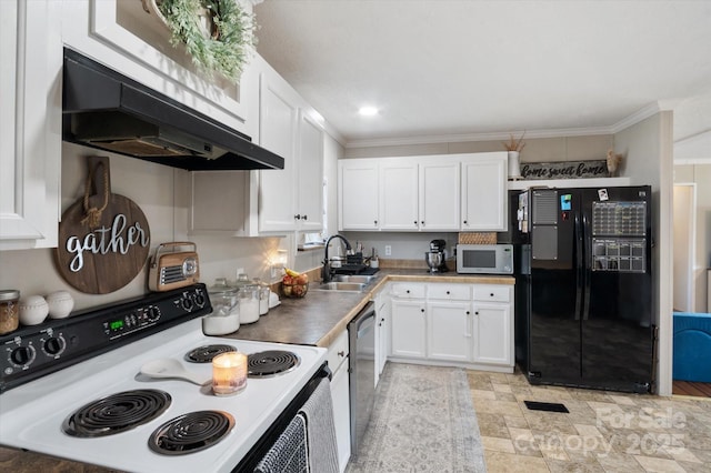 kitchen featuring sink, white cabinetry, black refrigerator, range with electric cooktop, and exhaust hood