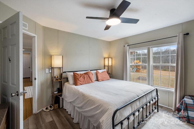 bedroom featuring hardwood / wood-style floors and ceiling fan