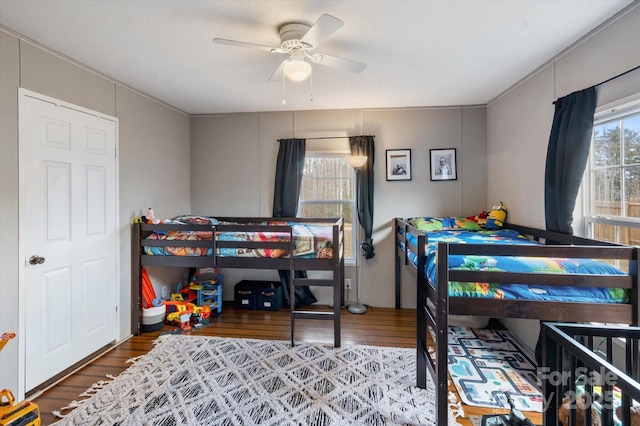 bedroom featuring hardwood / wood-style floors and ceiling fan