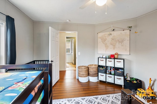 bedroom featuring ceiling fan and dark hardwood / wood-style flooring