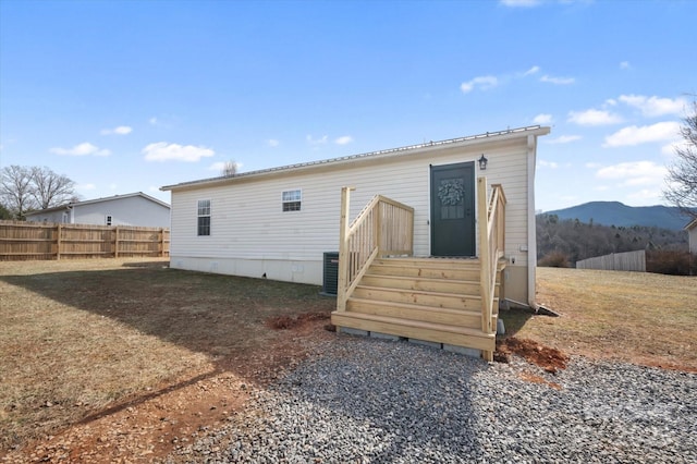 rear view of property featuring a mountain view