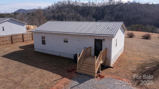 back of property with cooling unit