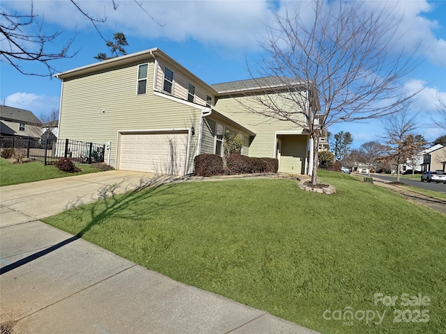 view of front of property with a garage and a front yard