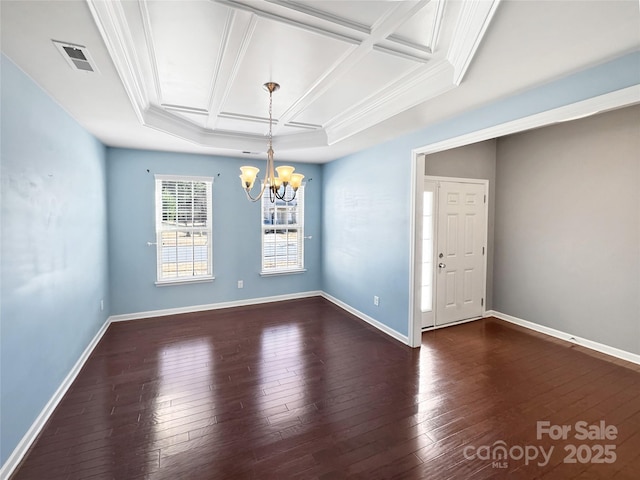 empty room with an inviting chandelier, dark hardwood / wood-style floors, and coffered ceiling