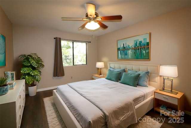 bedroom featuring dark hardwood / wood-style floors and ceiling fan