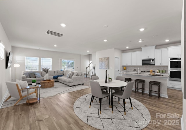 dining area featuring light hardwood / wood-style flooring