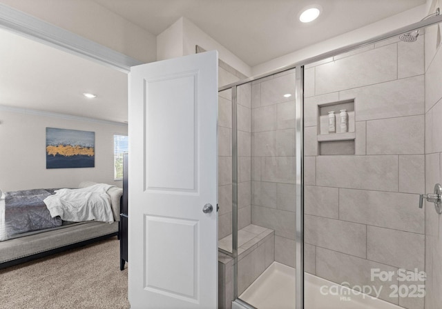 bathroom with a shower with door