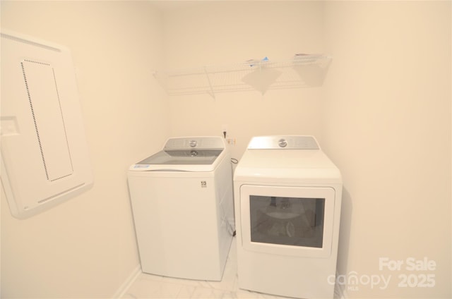 washroom with washing machine and clothes dryer