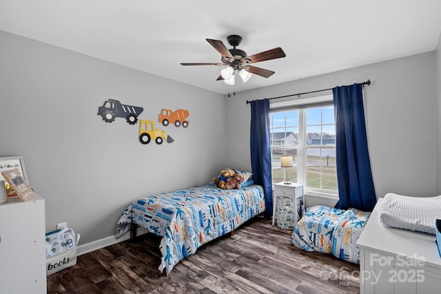 bedroom featuring dark wood-type flooring and ceiling fan