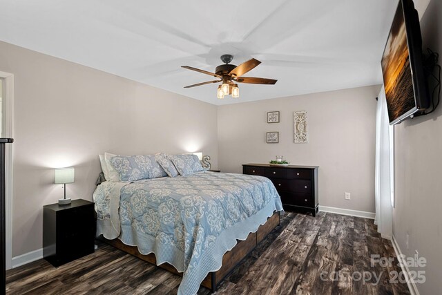 bedroom featuring dark hardwood / wood-style floors and ceiling fan