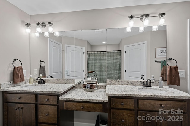 bathroom with vanity and a shower with shower curtain