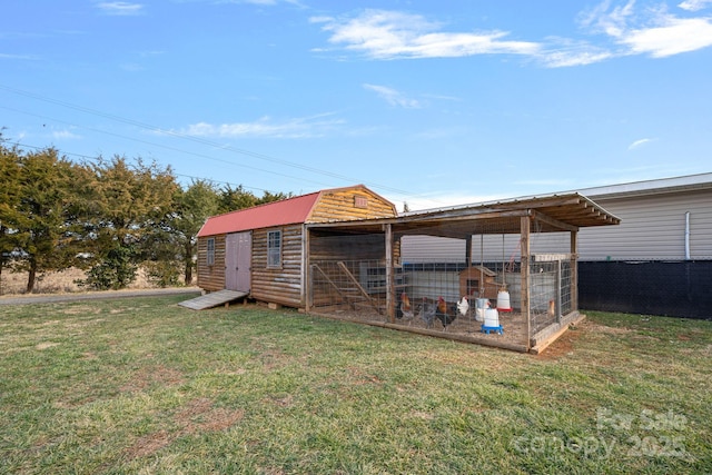 view of outdoor structure with a yard