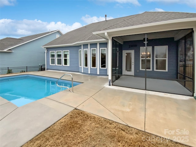 view of swimming pool with ceiling fan and a patio