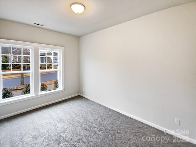 empty room with carpet flooring