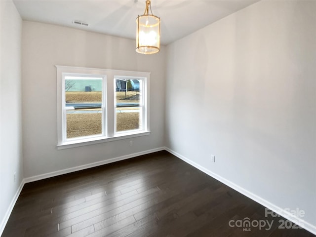 unfurnished dining area with dark hardwood / wood-style floors