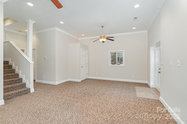 unfurnished living room with ornate columns, crown molding, carpet, and ceiling fan