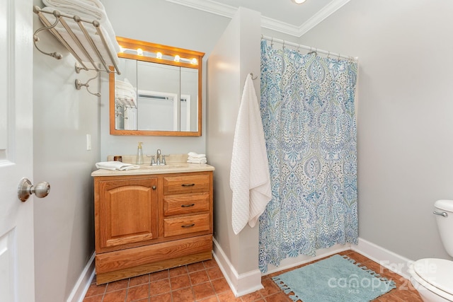 bathroom with ornamental molding, vanity, toilet, and tile patterned floors