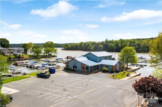 birds eye view of property featuring a water view