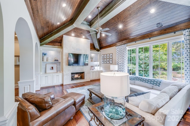 living room with ceiling fan, hardwood / wood-style floors, wooden ceiling, and a high end fireplace