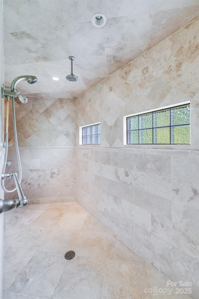 bathroom with a tile shower